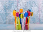 toothbrushes-ceramic-bowl-on-blurred-260nw-2503736943