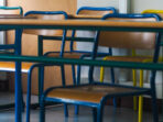 Rows of chairs in a classroom, during the covid-19 pandemic