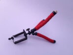 Mini portable tripod for phone photography laying on white background