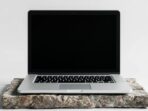 Silver-Laptop-on-Stone-Slab-with-Black-Screen_IJ9wK